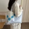 shy-floral-retro-tote-06-blue-on-model New Floral Retro PU Leather Tote Bag – Crochet Flower Detail